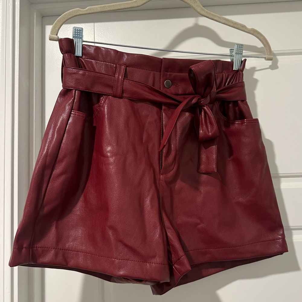 Tart red faux leather shorts